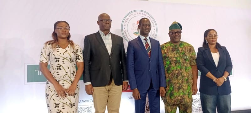 Oyedele flanked by other tax committee members