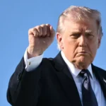 Trump gestures as he boards Air Force One on March 1, 2026 Mandel Ngan/AFP